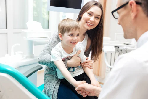 mom with child at dentist