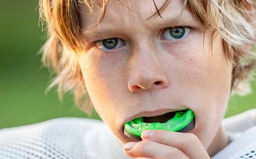 kid with mouth guard