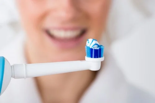 toothbrush with toothpaste on it